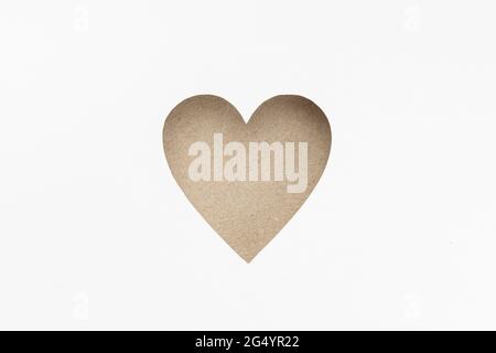 Die-cut Cardboard Heart shaped isolated on white paper background. Love concept Stock Photo