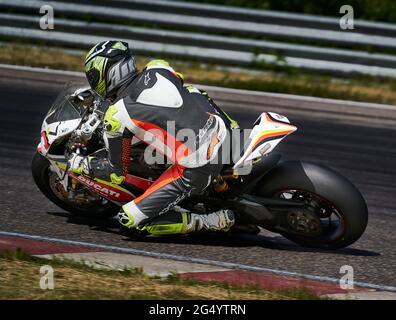 11-05-2020 Kaunas, Lithuania Motorcyclist at sport bike rides by empty asphalt road. sport bike. MotoGP race. Superbikes. Motorbikes racing. Stock Photo