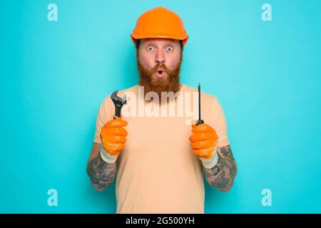 Incompetent worker is afraid and worried about his work Stock Photo