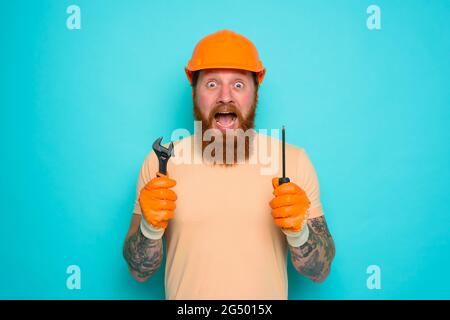 Incompetent worker is afraid and worried about his work Stock Photo