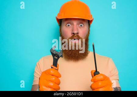 Incompetent worker is afraid and worried about his work Stock Photo