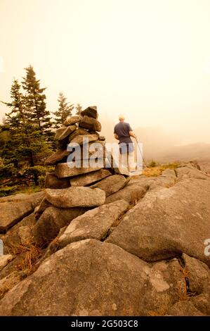 Man Hiking Along Coastal Trail at Fairy Head, Cutler Coast Public Land, Bold Coast Trail, Cutler, Maine, USA Stock Photo