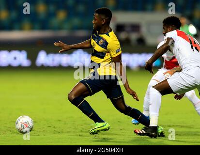 GOIANIA, BRAZIL - JUNE 23: Moises Caicedo of Ecuador competes for the ball with Christian Ramos of Peru ,during the match between Colombia and Peru as part of Conmebol Copa America Brazil 2021 at Estadio Olimpico on June 23, 2021 in Goiania, Brazil. MB Media Stock Photo