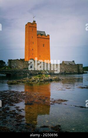 Kilcoe Castle, at Roaringwater Bay near Ballydehob, County Cork, Ireland.  The castle was originally built in the 15th century, and most recently rest Stock Photo