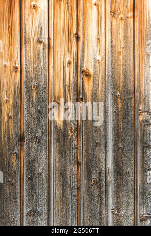 Closeup shot of brown, weathered wooden wall (background vertical) Stock Photo