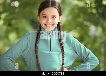Girl wear fleece jumper for active leisure nature background, summer vacation concept Stock Photo