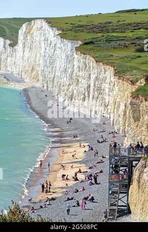 The chalk cliffs of the Seven Sisters coastline at Birling Gap, South Downs National Park on a hot sunny summers day, Eastbourne East Sussex England Stock Photo