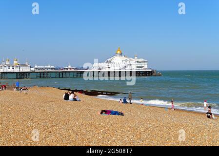 Eastbourne seafront pier and beach on a sunny summers evening, East Sussex England UK Stock Photo