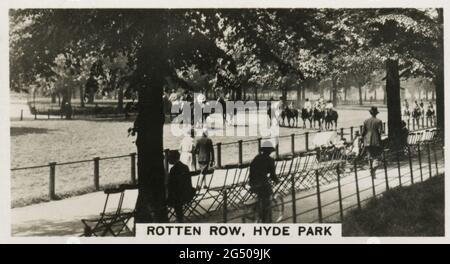 ‘Homeland Events’ W.D. & H.O. Wills cigarette card entitled, “Rotten Row, Hyde Park”. “Hyde Park, everyone knows, is the promenade of London. In the Ring, a circular road that runs round the Park, may be seen at certain seasons, people of many stations of life and visitors from all parts of the world. The photo shows riders in the famous Rotten Row.”. Published in 1932. Stock Photo