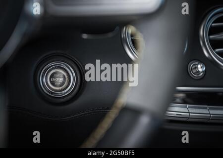 Elegant and Modern Start Stop Car Engine Ignition Button Close Up. Automotive Industry Theme. Stock Photo