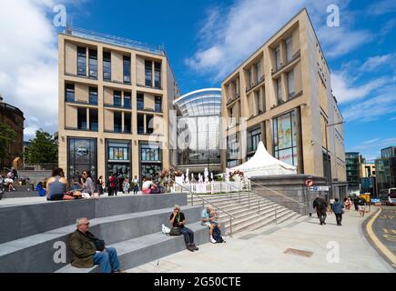 Edinburgh, Scotland, UK. 24 June 2021. First images of the new St James Quarter which opened this morning in Edinburgh. The large retail and residential complex replaced the St James Centre which occupied the site for many years. Pic; Members of the  public at entrance to mall on Leith Street .Iain Masterton/Alamy Live News Stock Photo