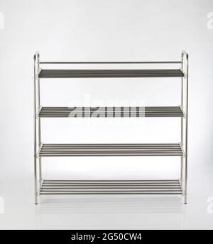 Empty stainless steel shoe racks isolated on white background Stock Photo