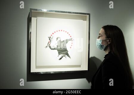 LONDON 24 June 2021.  BANKSY. Love Is In The Air (with stars). Estimate: GBP 1,500,000 - GBP 2,000,000The sale takes place on 30 June. IMAGES ARE ASKED TO BE UNDER EMBARGO UNTIL 10:30 AM. Credit amer ghazzal/Alamy Live News