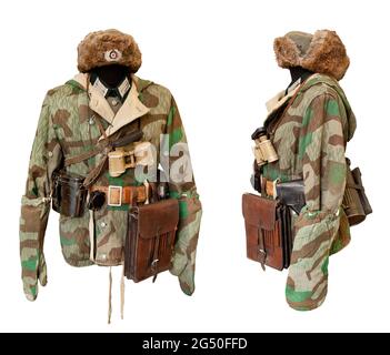 World War II period. Vintage German Wehrmacht uniform with winter double-sided parka Wehrmacht Splinter-A, fur hat, military binoculars and tablet. Na Stock Photo