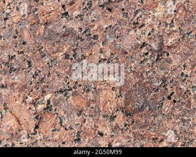 Natural red brown granite stone surface, seamless background photo texture Stock Photo