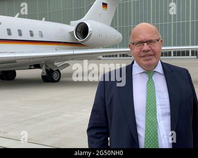 Berlin, Germany. 23rd June, 2021. German Economics Minister Peter Altmaier (CDU) stands on the apron of the airport before his departure for the US. (to dpa 'Altmaier sees transatlantic reboot - trip to Washington') Credit: Andreas Hoenig/dpa/Alamy Live News Stock Photo