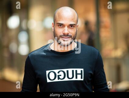 Hamburg, Germany. 24th June, 2021. David Odonkor, former German national football player, photographed on the sidelines of a charity event in the Hanseviertel shopping centre. Credit: Daniel Reinhardt/dpa/Alamy Live News Stock Photo