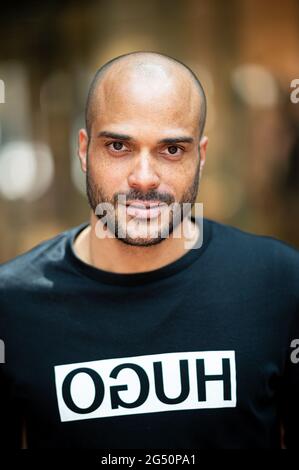 Hamburg, Germany. 24th June, 2021. David Odonkor, former German national football player, photographed on the sidelines of a charity event in the Hanseviertel shopping centre. Credit: Daniel Reinhardt/dpa/Alamy Live News Stock Photo