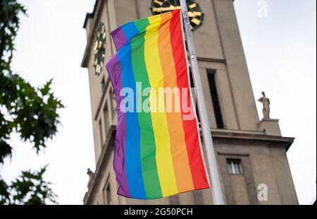 Berlin, Germany. 24th June, 2021. A rainbow flag flies in front of Schöneberg City Hall. Credit: Christophe Gateau/dpa/Alamy Live News Stock Photo