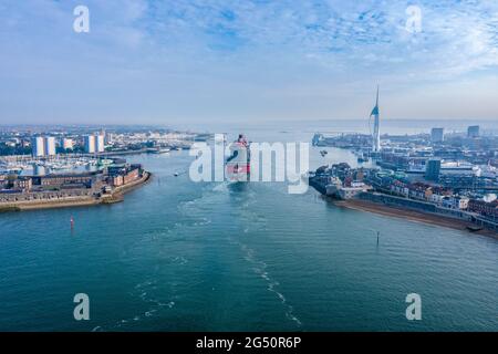 Scarlet Lady is a cruise ship operated by Virgin Voyages.  Scarlet Lady arriving at Portsmouth International Port on a sunny morning. Stock Photo