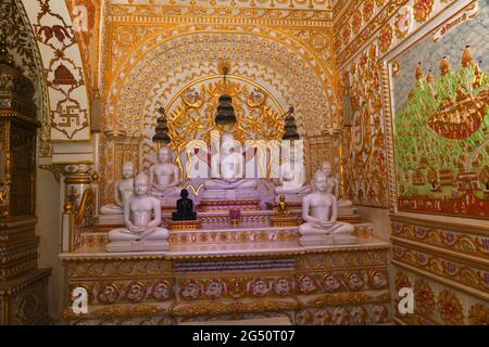 Beawar, Rajasthan, India, June 24, 2021: Idols of Jain Tirthankar with golden interior view at Digamber jain temple in Beawar. Credit: Sumit Saraswat/Alamy Live News Stock Photo