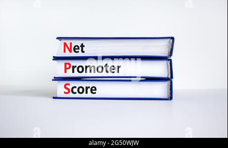 NPS net promoter score symbol. Books with words 'NPS net promoter score'. Beautiful white background. Business and NPS net promoter score concept. Cop Stock Photo