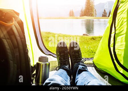 Adventure Travel Camp. Nature Vacation. Landscape View Inside Hiking Tent Stock Photo