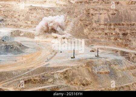 Mining blast at an open pit copper mine in Chile Stock Photo