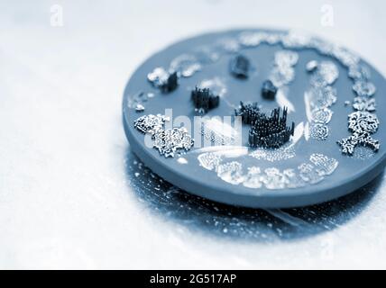 Disk after cutting tooth dental crowns created on 3d printer for metal Stock Photo