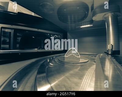 Object printed from metal powder on metal 3d printer, working chamber Stock Photo