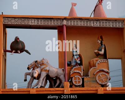 Lord krishna and arjuna statue art sculpture presented on temple. Stock Photo