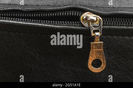 Old metal zipper bag close-up, zip on a leather bag, copy space Stock Photo