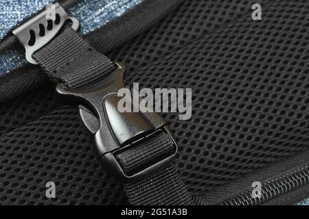 Semi-automatic fastener for connectiong fabric tapes of the travel backpack exuipment concept, close-up background Stock Photo
