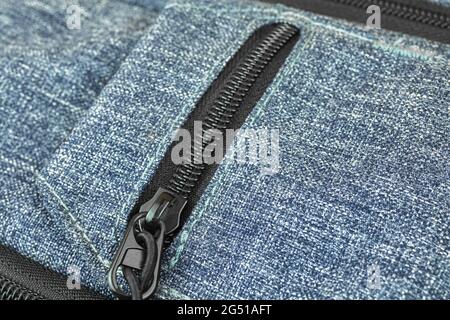 Small pocket on a backpack and zipper bag close-up Stock Photo