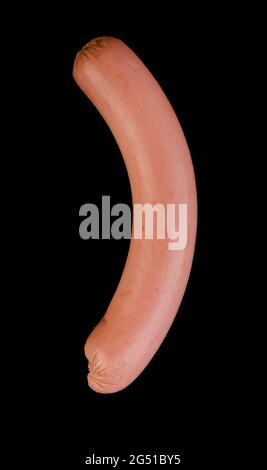 One boiled sausage, located, on a black background, isolated Stock Photo