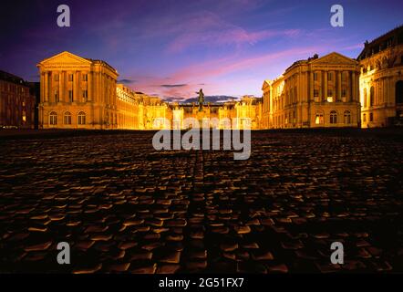 View of illuminated Palace of Versailles at night, Versailles, France Stock Photo
