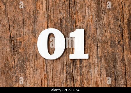 Zero one - Wooden numbers on rustic background Stock Photo
