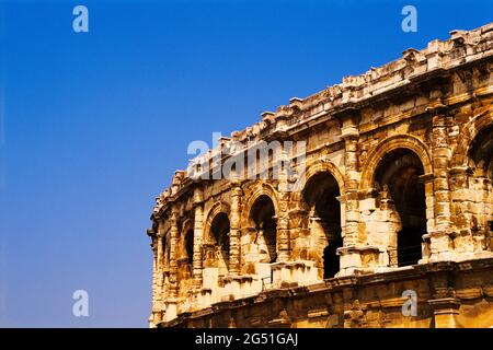 Ancient Roman amphitheater of Arena of Nimes against clear sky, Nimes, France Stock Photo