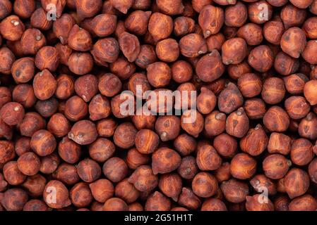 Brown chickpeas background. Red chickpea bean. Garbanzo, bengal gram or chick pea bean. Stock Photo