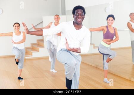Cheerful african american man practicing vigorous dance movements Stock Photo