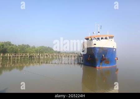 Tourist boat resting on a beach on St. Martins Island, Bangladesh Stock Photo