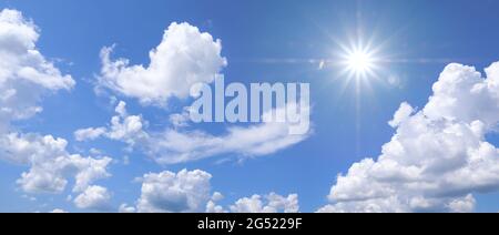 Beautiful clear blue sky with white clouds and sun Stock Photo