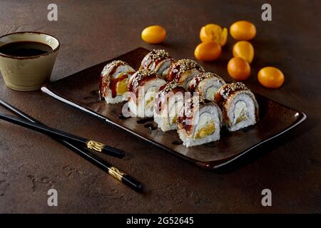 Premium Photo  Japanese food sushi rolls with eel and cream cheese topped  with unagi sauce