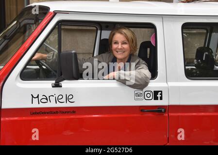 Cologne, Germany. 24th June, 2021. Actress Mariele Millowitsch christens VW oldtimer Billis T3 with the names 'Pitter' and 'Mariele'. With this buses love your city - tours through Cologne can be booked. Credit: Horst Galuschka/dpa/Alamy Live News Stock Photo