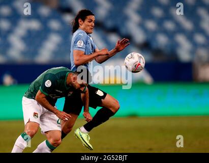 CUIABA, BRAZIL - JUNE 24: Edinson Cavani of Uruguay competes for the ball with Danny Bejarano of Bolivia ,during the match between Bolivia and Uruguay as part of Conmebol Copa America Brazil 2021 at Arena Pantanal on June 24, 2021 in Cuiaba, Brazil. (MB Media) Stock Photo