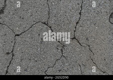 Seamless cracked gray road asphalt texture Stock Photo