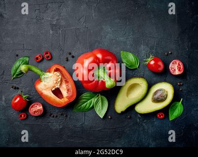 various fresh raw vegetables composition on black painted background, top view Stock Photo