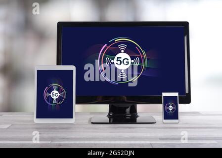 5g concept shown on different information technology devices Stock Photo