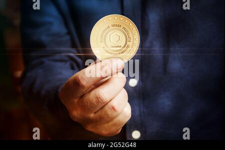 Chainlink link cryptocurrency symbol golden coin in hand abstract concept. Stock Photo