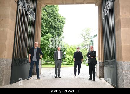 Stuttgart, Germany. 25th June, 2021. The artistic directors of the Staatstheater Stuttgart Burkhard C. Kosminski (l-r, Schauspiel), Viktor Schoner (Oper), Tamas Detrich (Ballett) and Marc-Oliver Hendriks (managing artistic director) stand in an entrance to the theatre during a photo session. During a press conference they present their plans for the next season. Credit: Bernd Weissbrod/dpa/Alamy Live News Stock Photo